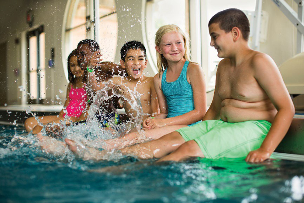 Kids are required to sit on the edge while waiting for swim instructions.